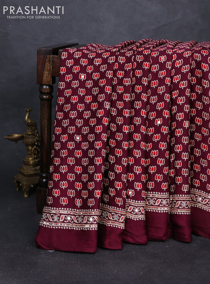 Modal silk saree wine shade with allover ajrakh prints and mirror & sequin embroidery pallu