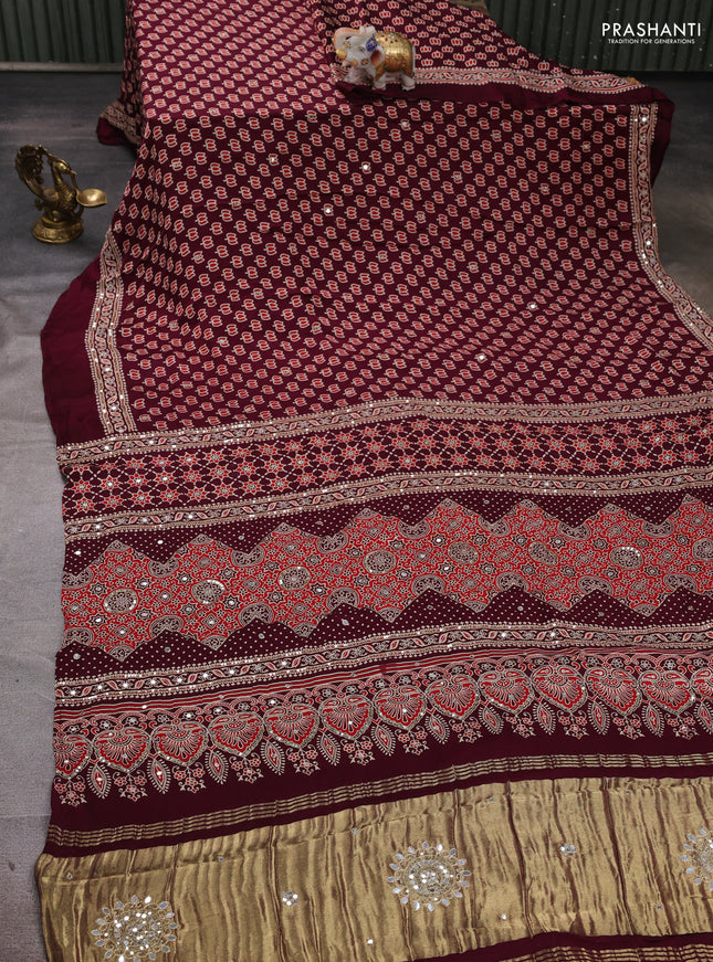 Modal silk saree wine shade with allover ajrakh prints and mirror & sequin embroidery pallu