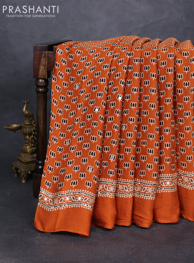 Modal silk saree dark mustard with allover ajrakh prints and mirror & sequin embroidery pallu