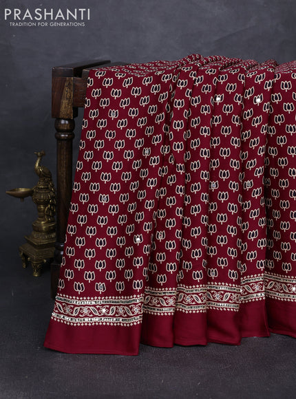 Modal silk saree maroon with allover ajrakh prints and mirror & sequin embroidery pallu