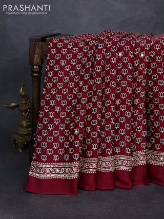 Modal silk saree maroon with allover ajrakh prints and mirror & sequin embroidery pallu