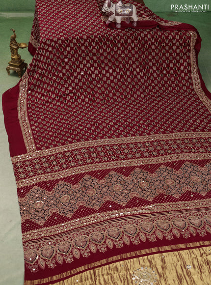 Modal silk saree maroon with allover ajrakh prints and mirror & sequin embroidery pallu