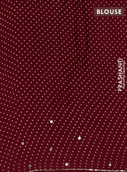Modal silk saree maroon with allover ajrakh prints and mirror & sequin embroidery pallu