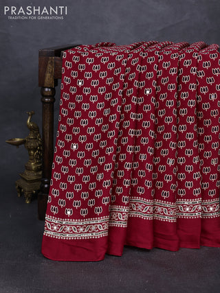 Modal silk saree tomato red with allover ajrakh prints and mirror & sequin embroidery pallu