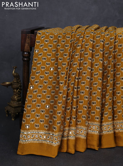 Modal silk saree mustard yellow with allover ajrakh prints and mirror & sequin embroidery pallu