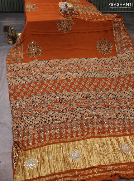 Modal silk saree rustic orange with allover ajrakh prints and mirror & sequin embroidery pallu