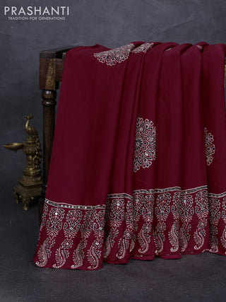 Modal silk saree maroon with ajrakh butta prints and mirror & sequin embroidery pallu