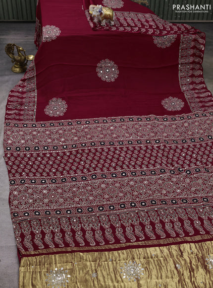 Modal silk saree maroon with ajrakh butta prints and mirror & sequin embroidery pallu