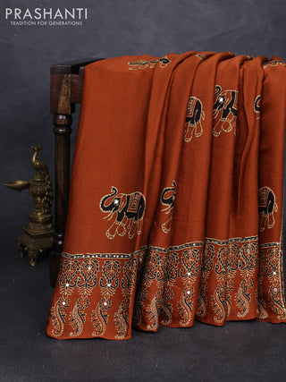 Modal silk saree dark mustard with ajrakh butta prints and mirror & sequin embroidery pallu