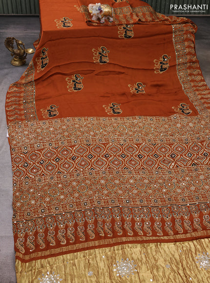 Modal silk saree dark mustard with ajrakh butta prints and mirror & sequin embroidery pallu