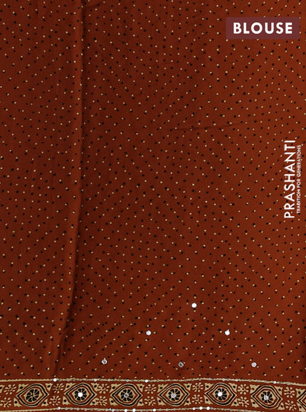 Modal silk saree dark mustard with ajrakh butta prints and mirror & sequin embroidery pallu