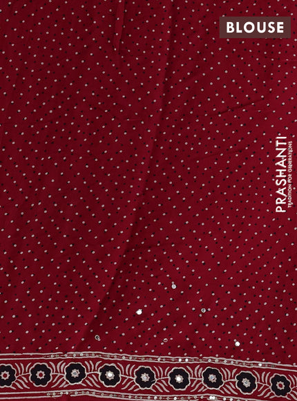 Modal silk saree red with ajrakh butta prints and mirror & sequin embroidery pallu