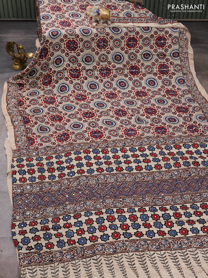 Modal silk saree beige with allover ajrakh prints and mirror & sequin embroidery pallu