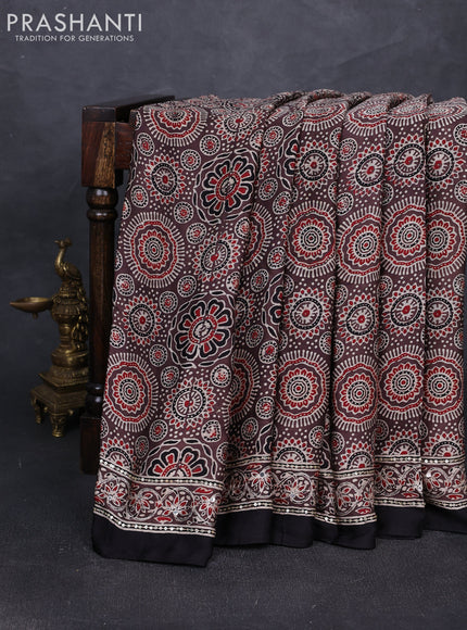 Modal silk saree pastel brown and black with allover ajrakh prints and mirror & sequin embroidery pallu