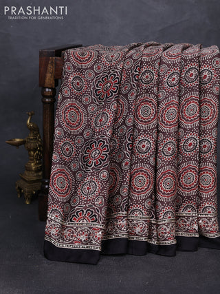 Modal silk saree pastel brown and black with allover ajrakh prints and mirror & sequin embroidery pallu