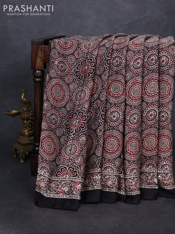 Modal silk saree pastel brown and black with allover ajrakh prints and mirror & sequin embroidery pallu