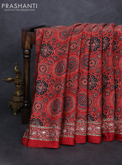 Modal silk saree rustic orange with allover ajrakh prints and mirror & sequin embroidery pallu