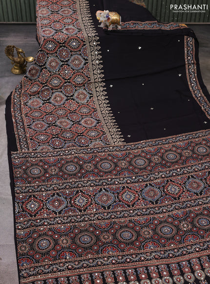 Modal silk saree black with allover ajrakh prints and mirror & sequin embroidery pallu