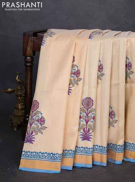 Uppada block printed silk saree cream and cs blue with butta prints and zari woven border
