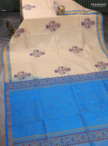 Uppada block printed silk saree cream and cs blue with butta prints and zari woven border