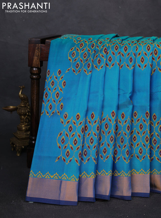 Uppada block printed silk saree cs blue and coffee brown with allover prints and zari woven border
