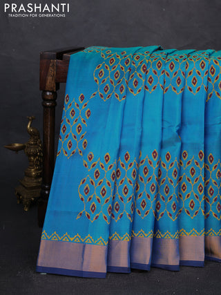 Uppada block printed silk saree cs blue and coffee brown with allover prints and zari woven border