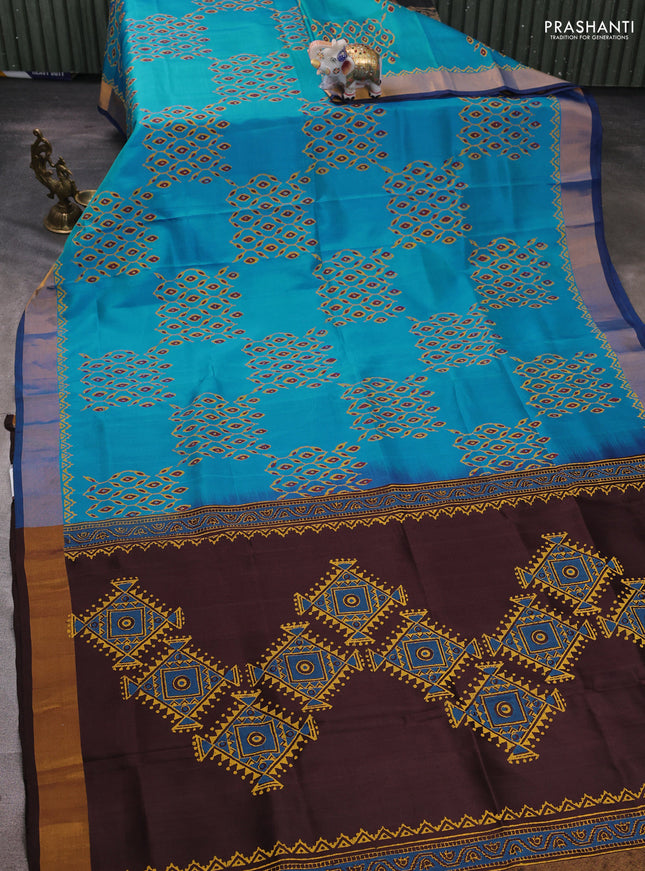 Uppada block printed silk saree cs blue and coffee brown with allover prints and zari woven border