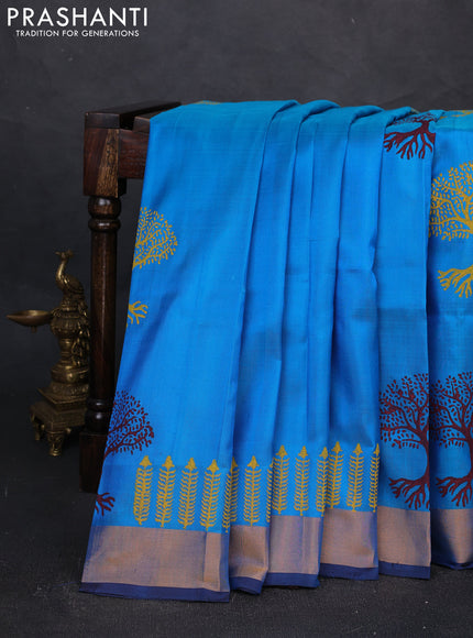 Uppada block printed silk saree cs blue and coffee brown with tree butta prints and zari woven border