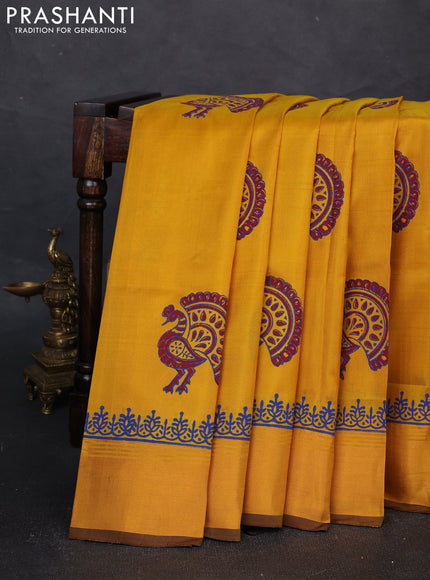 Uppada block printed silk saree mustard yellow and coffee brown with peacock butta prints and zari woven border