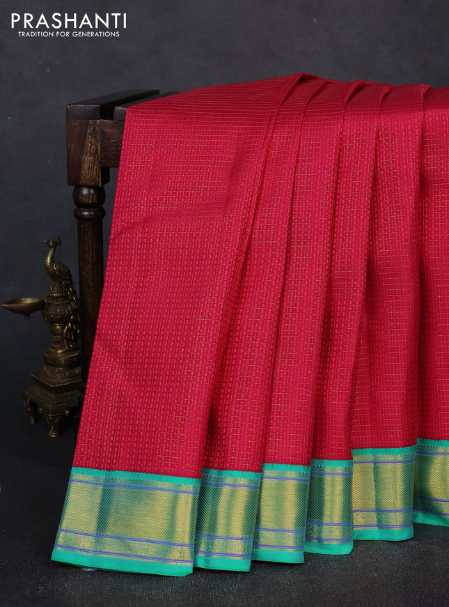 Pure kanchipuram silk saree pink and teal green with allover zari checks & self emboss and zari woven border