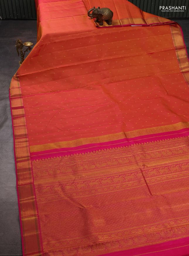 Pure kanchipuram silk saree dual shade of pinkish orange and pink with allover zari woven buttas and zari woven border