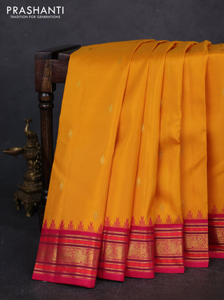 Pure kanchipuram silk saree yellow and pink with zari woven buttas and temple design zari woven border