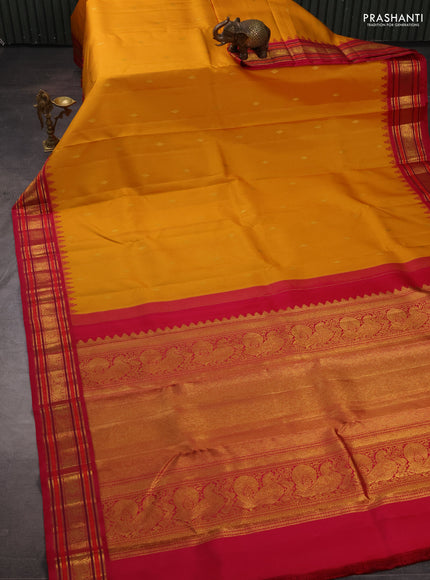 Pure kanchipuram silk saree yellow and pink with zari woven buttas and temple design zari woven border