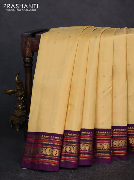 Pure kanchipuram silk saree pale yellow and violet with zari woven buttas and zari woven korvai border