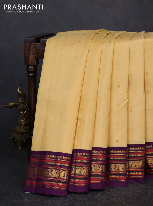 Pure kanchipuram silk saree pale yellow and violet with zari woven buttas and zari woven korvai border