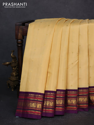 Pure kanchipuram silk saree pale yellow and violet with zari woven buttas and zari woven korvai border