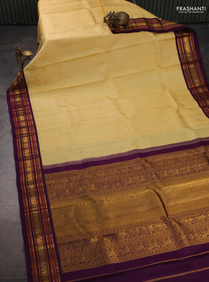 Pure kanchipuram silk saree pale yellow and violet with zari woven buttas and zari woven korvai border