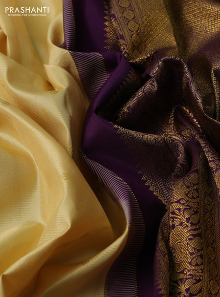 Pure kanchipuram silk saree pale yellow and violet with zari woven buttas and zari woven korvai border