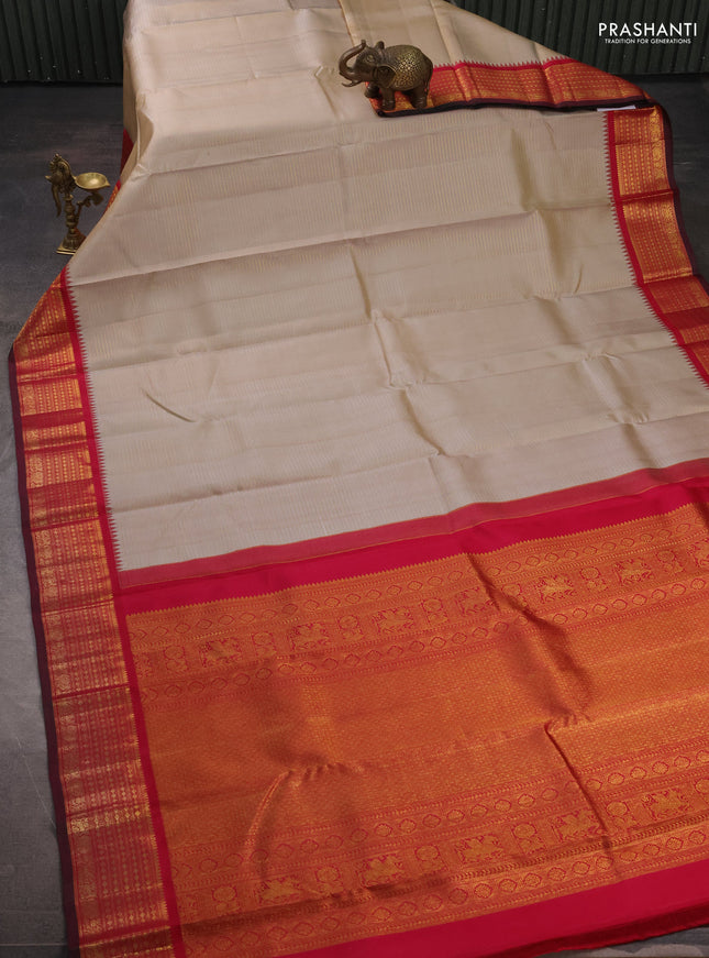 Pure kanchipuram silk saree beige and maroon with allover zari weaves and zari woven border