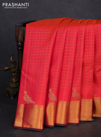 Pure kanchipuram silk saree orange and pink with allover zari checked pattern and zari woven border