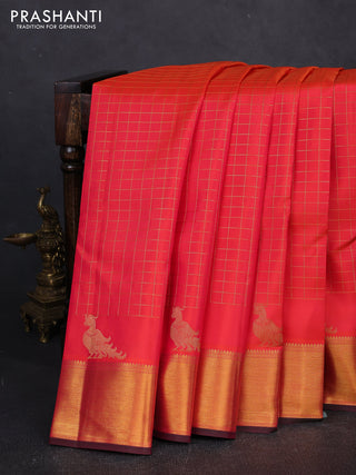 Pure kanchipuram silk saree orange and pink with allover zari checked pattern and zari woven border