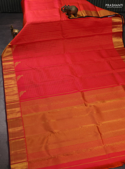 Pure kanchipuram silk saree orange and pink with allover zari checked pattern and zari woven border