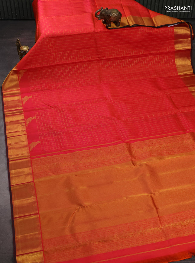 Pure kanchipuram silk saree orange and pink with allover zari checked pattern and zari woven border