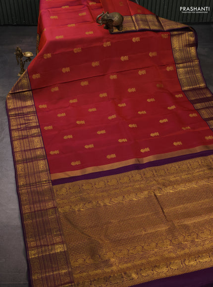 Pure kanchipuram silk saree rust shade and violet with zari woven buttas and long zari woven border