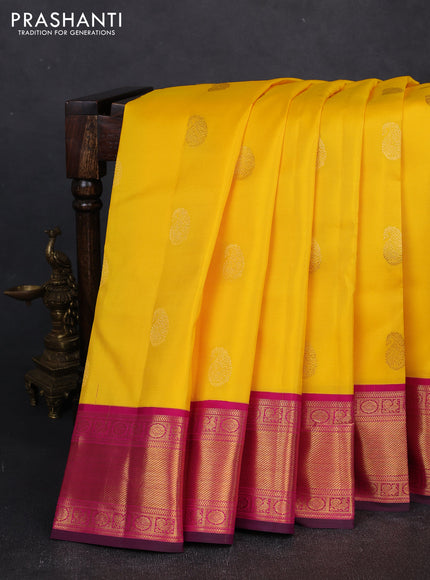 Pure kanchipuram silk saree yellow and magenta pink with zari woven buttas and zari woven korvai border