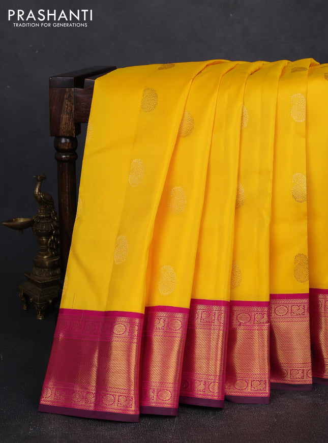 Pure kanchipuram silk saree yellow and magenta pink with zari woven buttas and zari woven korvai border