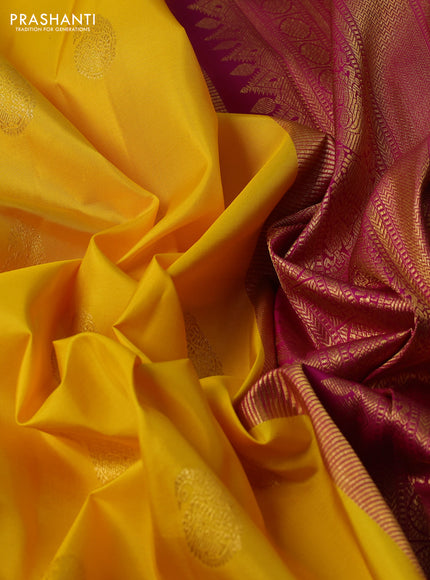Pure kanchipuram silk saree yellow and magenta pink with zari woven buttas and zari woven korvai border