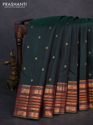 Pure kanchipuram silk saree bottle green with allover zari woven buttas and long zari woven border