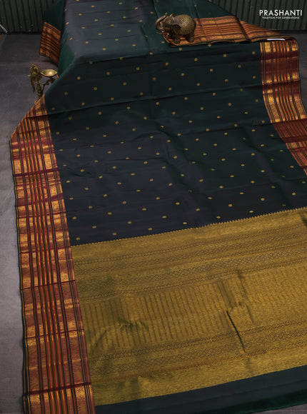 Pure kanchipuram silk saree bottle green with allover zari woven buttas and long zari woven border
