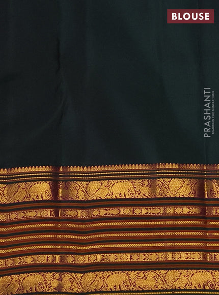 Pure kanchipuram silk saree bottle green with allover zari woven buttas and long zari woven border